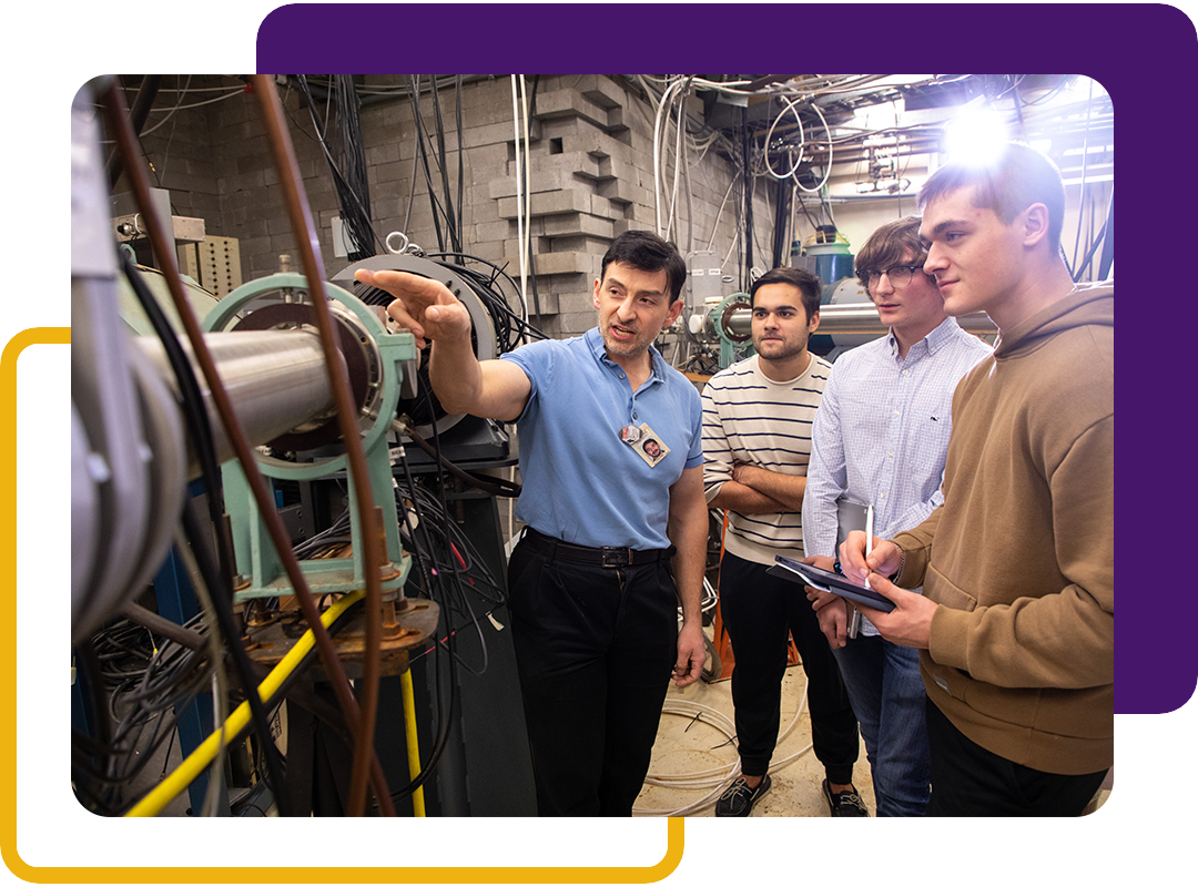 A person explaining machinery to three students.