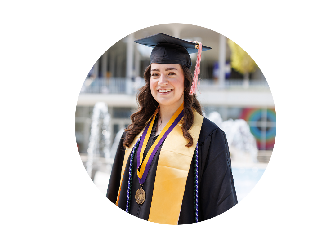 A student wearing a graduation cap and gown.